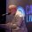 Adrian Snell speaking at Bristol, with a small tree shaped light decoration on the lectern