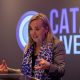 Amy Orr-Ewing speaking in front of a projected Catalyst Live logo