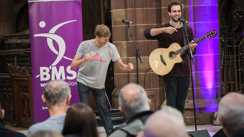 Harry and Chris performing with audience members in the foreground